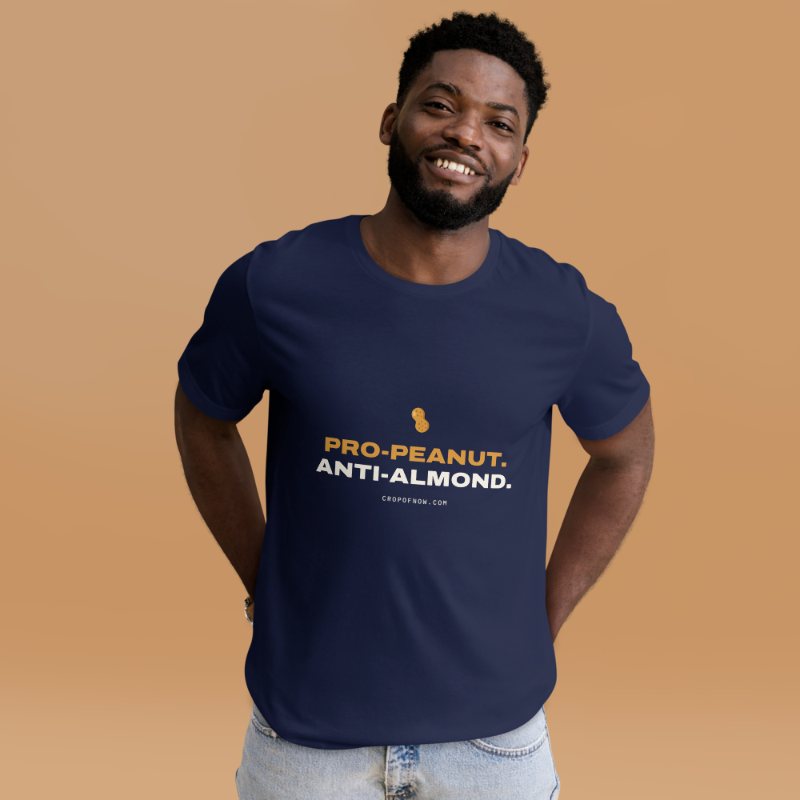 Smiling man in a navy t-shirt reading Pro-Peanut. Anti-Almond.
