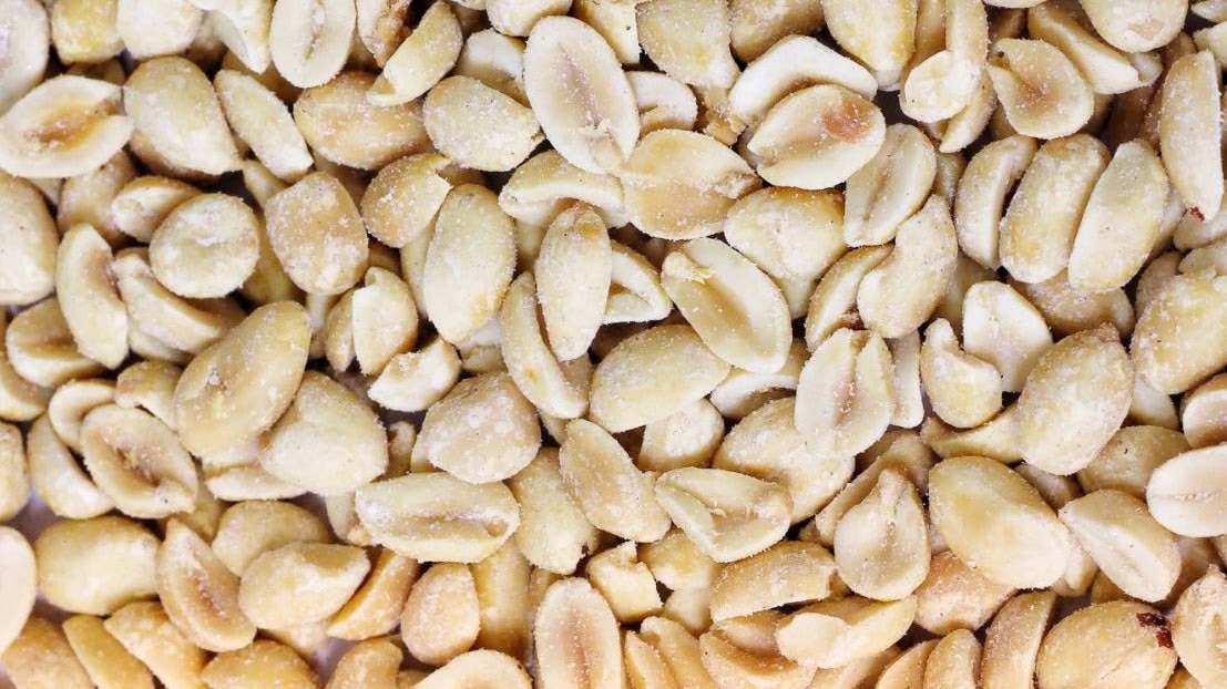 A close-up of shelled roasted peanuts